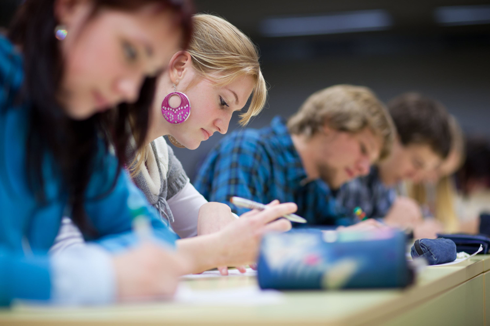 Teenages studying at higher education facility.