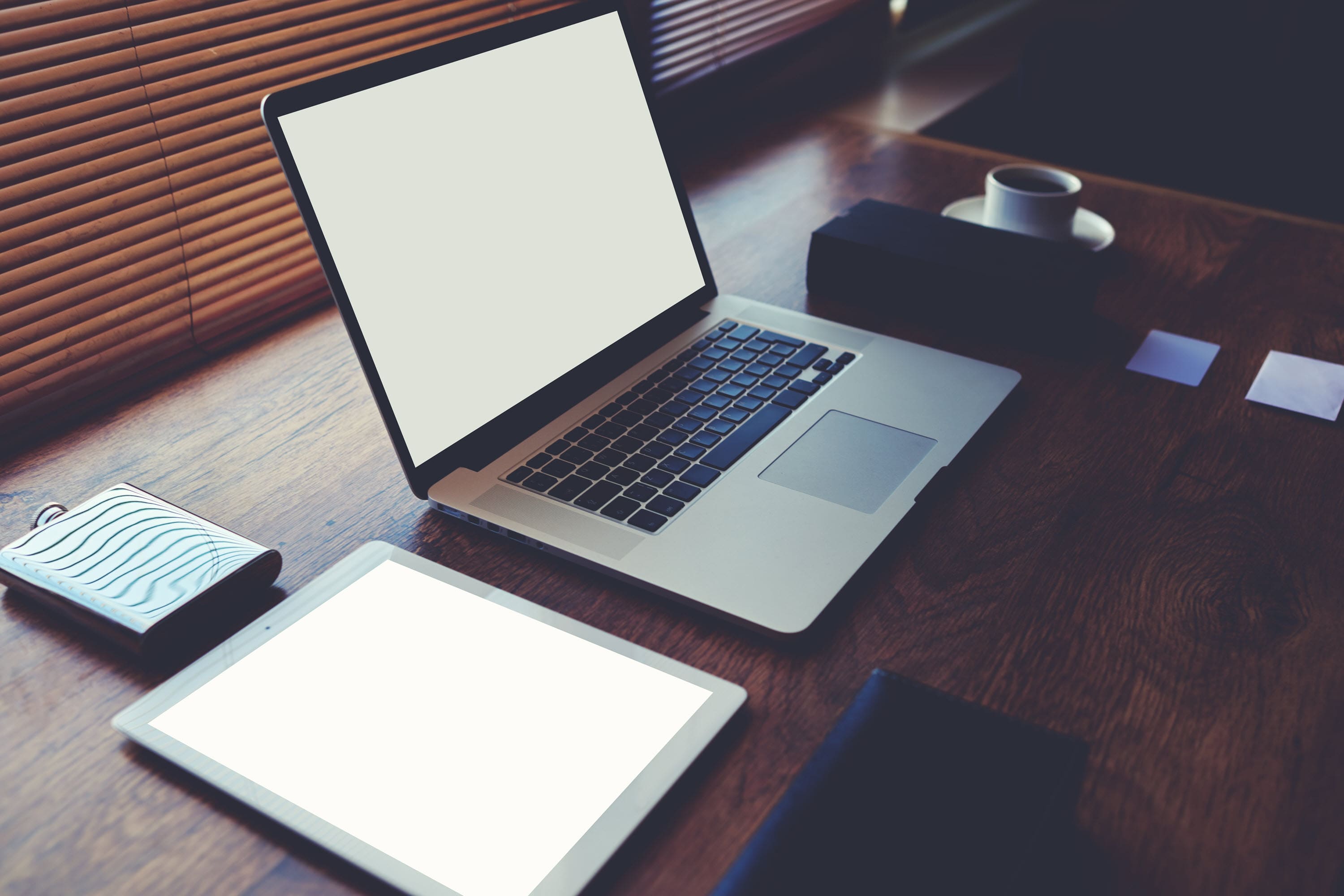 Laptop and tablet at computer ready to complete digital marketing courses.