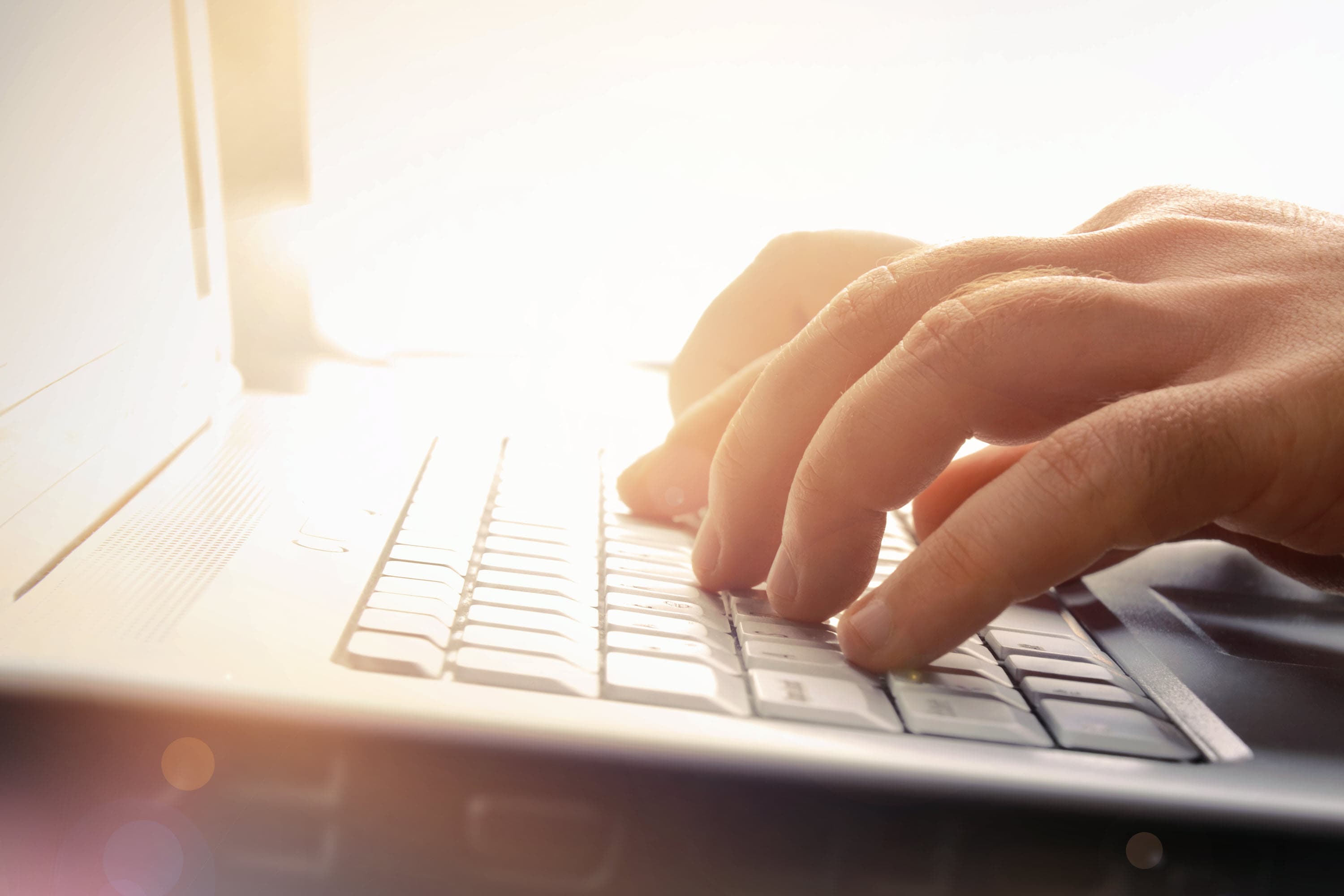 Business person sitting at computer.