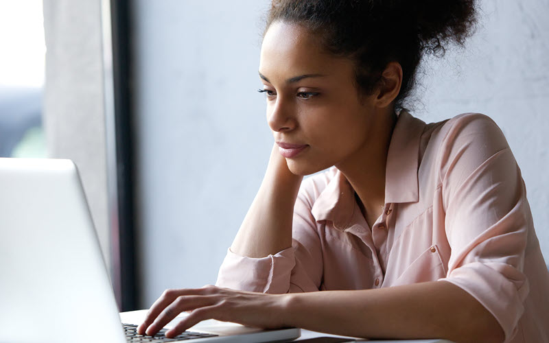 Women working on social media marketing management tools.